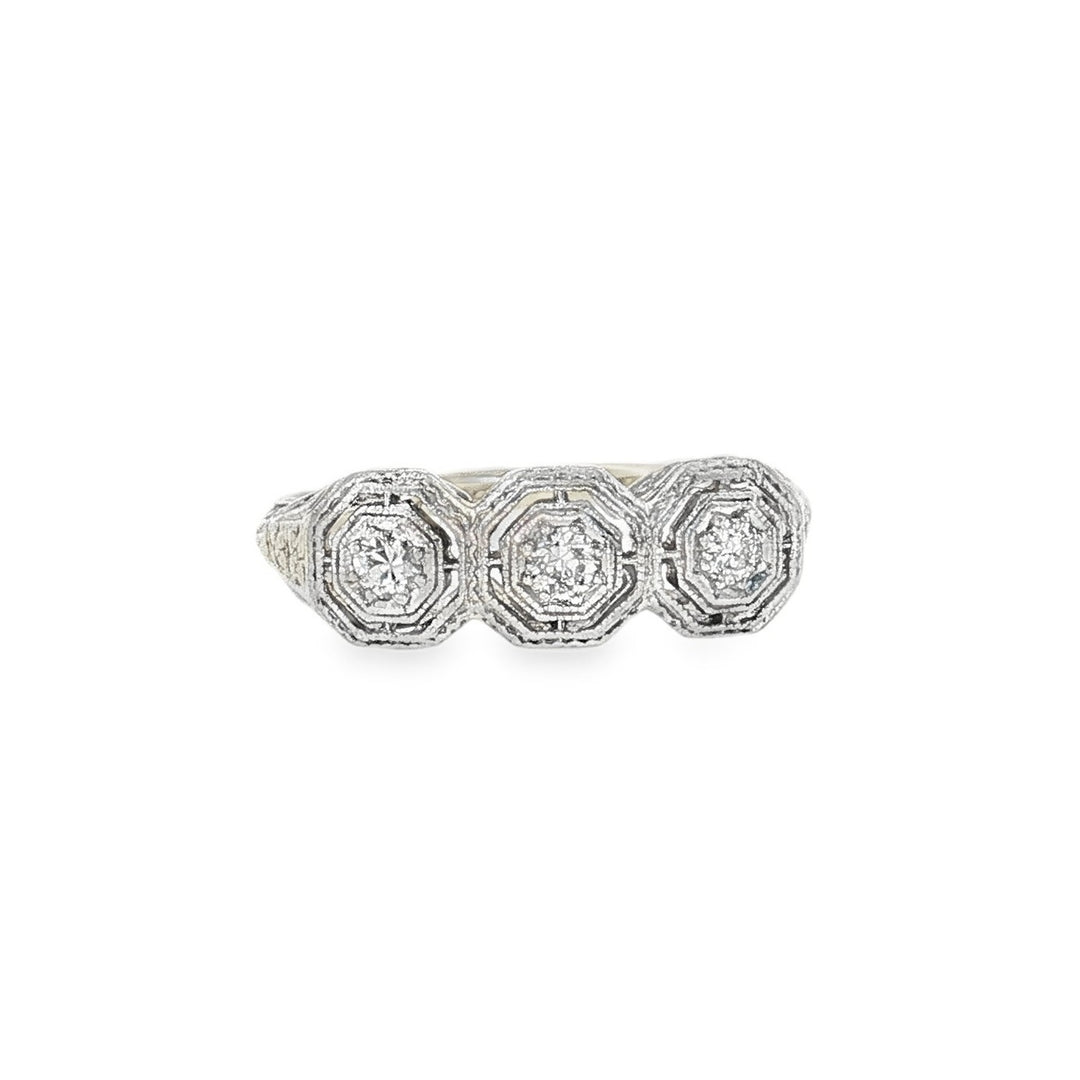 Estate Early 20th century 14kt two-tone gold three stone diamond ring.