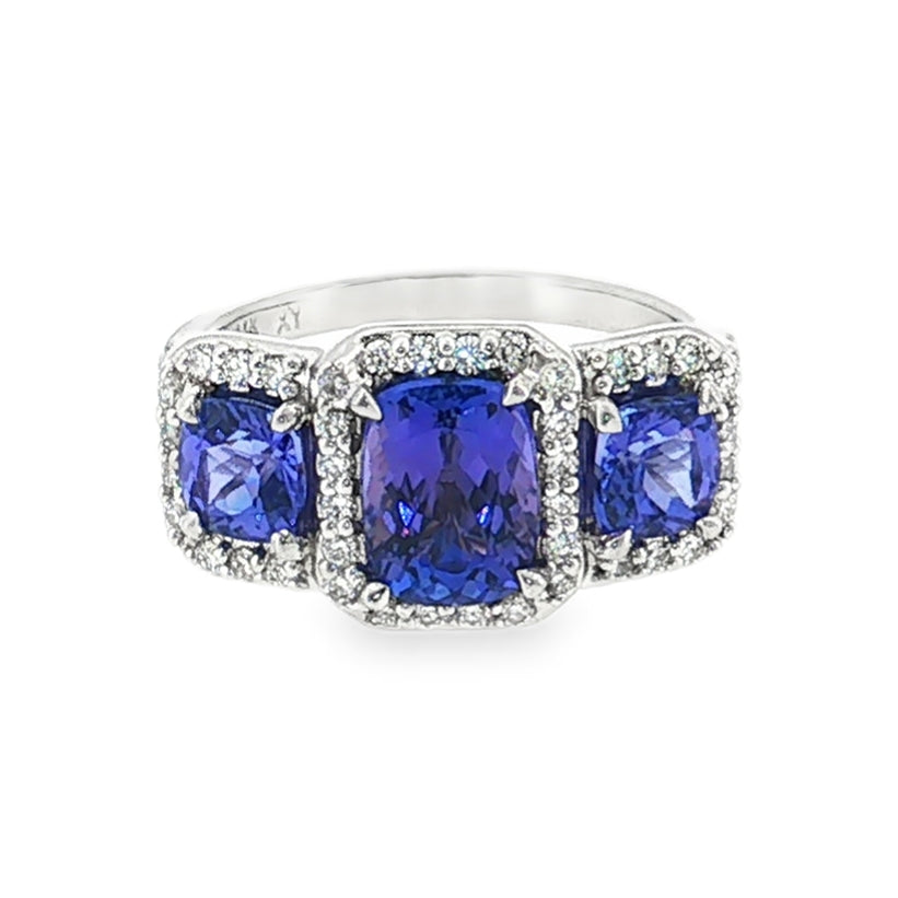14kt white gold tanzanite and diamond three-stone halo ring