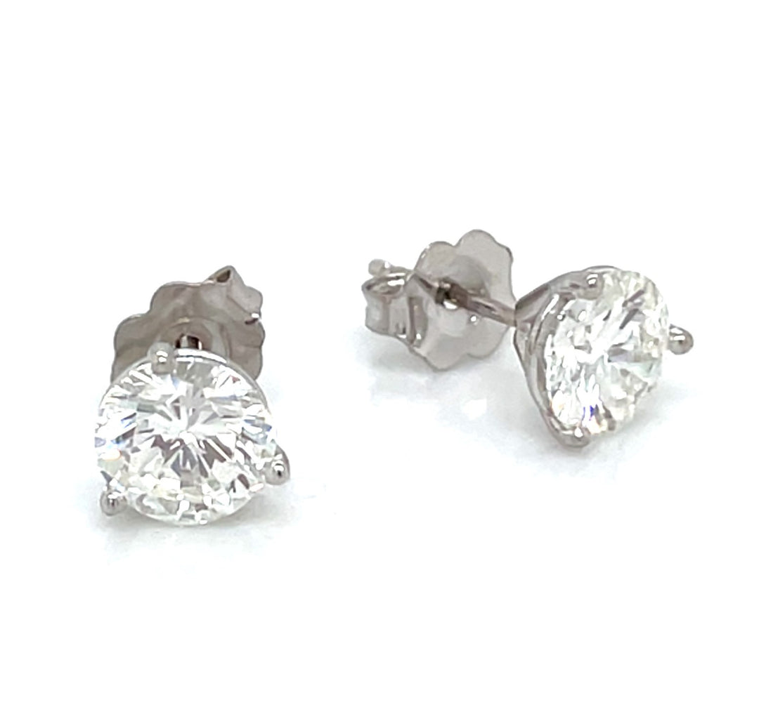 14kt white gold 1.61 carat diamond solitaire stud earrings.