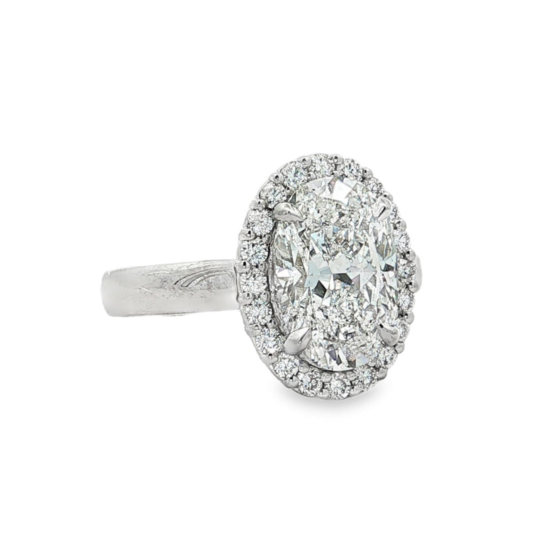 Peter Storm platinum oval diamond halo engagement ring