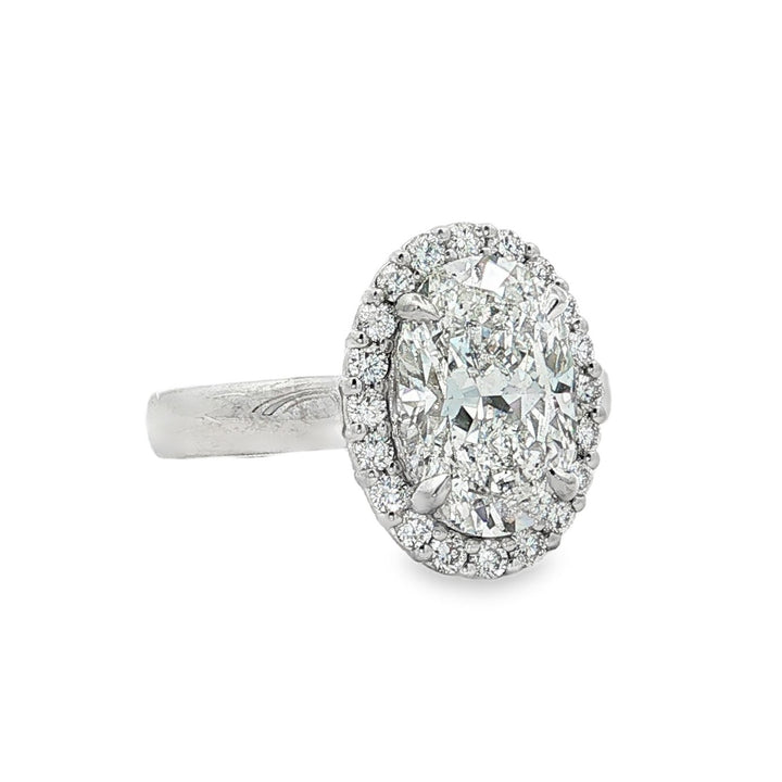 Peter Storm platinum oval diamond halo engagement ring